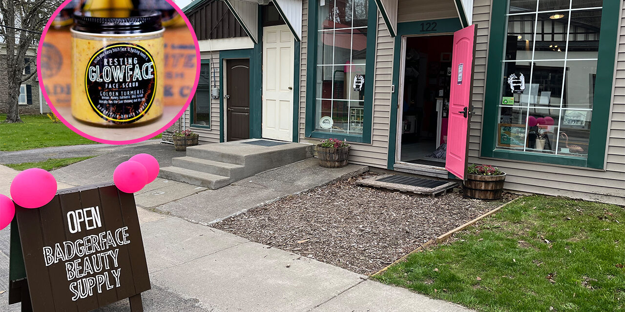 storefront with vibrant pink door and an open sign on the sidewalk with pink balloons, Inset picture shows facial scrub jar